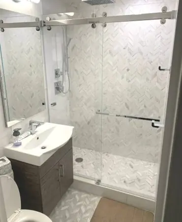Sliding frameless shower doors